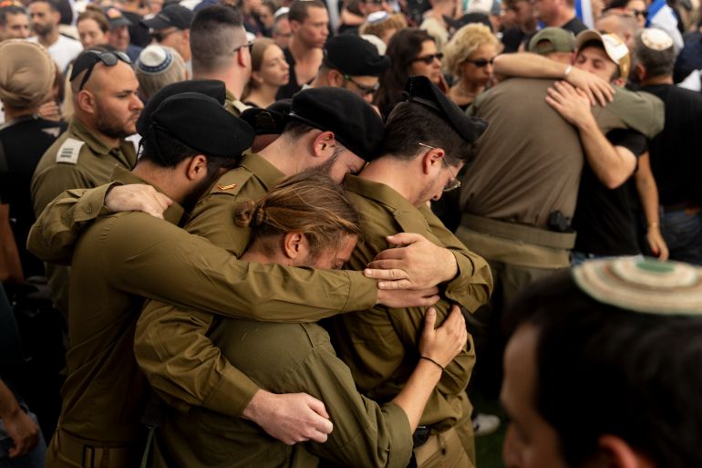BEIT HASHMONAI, ISRAEL - APRIL 27: Israeli soldiers mourn during a funeral for Master Sergeant (res) Asaf Cafri killed in a battle in the northern Gaza Strip on April 27, 2025 in Best Hashmonai, Israel. According to the IDF, Cafri, a tank driver was hit and three other soldiers were wounded by sniper fire in the Beit Hanoun area, close to military post in the buffer zone. Beside Cafri, Police officer Sgt.Neta Yitzhak Kahane and commander Cpt. Ido Voloch were killed during fighting in Gaza City's Shejaiya neighbourhood, as IDF prepares for more offensive operation. (Photo by Amir Levy/Getty Images)