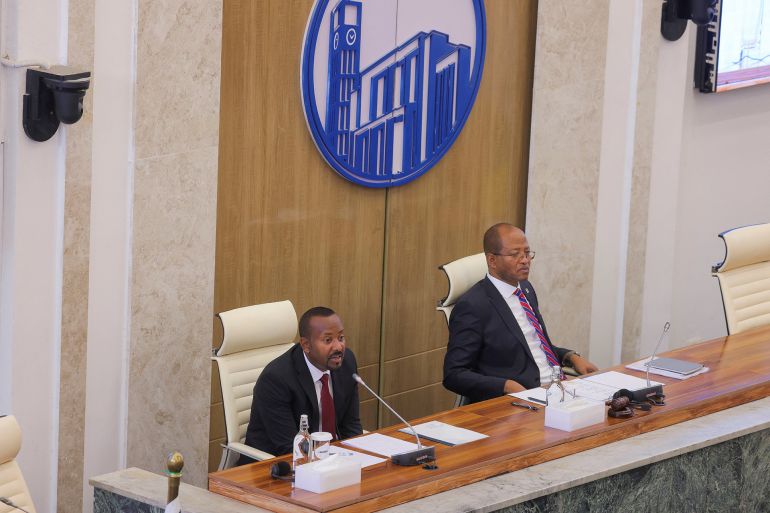 ما رسالة إثيوبيا من دعوة مصر والسودان لحفل افتتاح سد النهضة؟ 1 Ethiopia's Prime Minister Abiy Ahmed and the Speaker of the House of Peoples Representatives Tagesse Chafo address parliament members on the current situation of the country at the parliament building, in Addis Ababa, Ethiopia, March 20, 2025. REUTERS/Tiksa Negeri