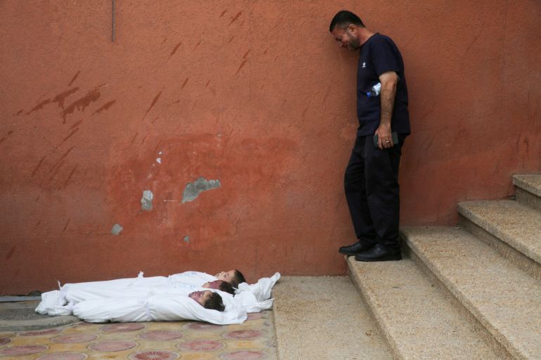 كاتب أسترالي: هل ينتبه العالم لمجزرة غزة في ذكرى سربرنيتسا؟ 1 SENSITIVE MATERIAL. THIS IMAGE MAY OFFEND OR DISTURB A mourner reacts next to the bodies of Palestinian brothers, Yahia, Mussa, and Ibraheem Jadallah, who were killed along with their mother, Asya, in an overnight Israeli strike on their house, according to medics, at Nasser hospital in Khan Younis, in the southern Gaza Strip, July 10, 2025. REUTERS/Hatem Khaled TPX IMAGES OF THE DAY