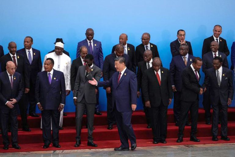 China's President Xi Jinping, center, shows the way to leaders from African countries as they proceed to the opening ceremony of the China Africa Forum after a group photo session at the Great Hall of the People in Beijing, China Thursday, Sept. 5, 2024. Andy Wong/Pool via REUTERS