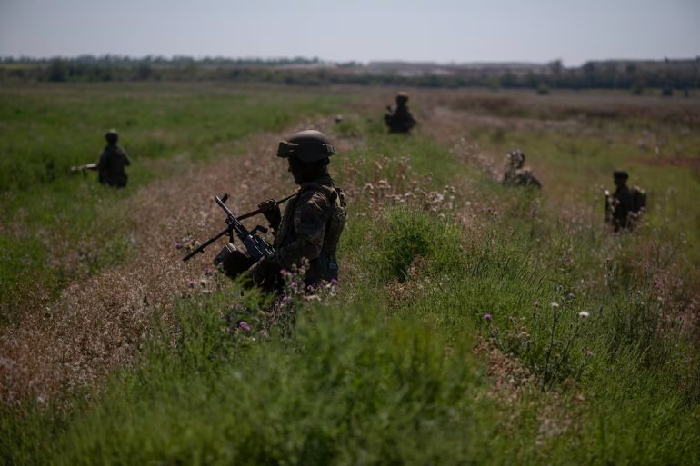 DONETSK OBLAST, UKRAINE - AUGUST 15: Colombian mercenaries, fighting for Ukraine, during conducting of a military exercise on the training ground on August 15, 2023 in Donetsk Oblast, Ukraine. Not only military volunteers from other countries are fighting for Ukraine, but also hundreds of Colombian mercenaries. Colombian fighters are increasingly drawn to Ukraine because the pay they receive there is much higher than what is normally paid in Colombia. Colombia is fertile ground for recruitment because it has the largest army in South America - after decades of fighting Marxist rebels and drug cartels. (Photo by Viktor Fridshon/Global Images Ukraine via Getty Images)