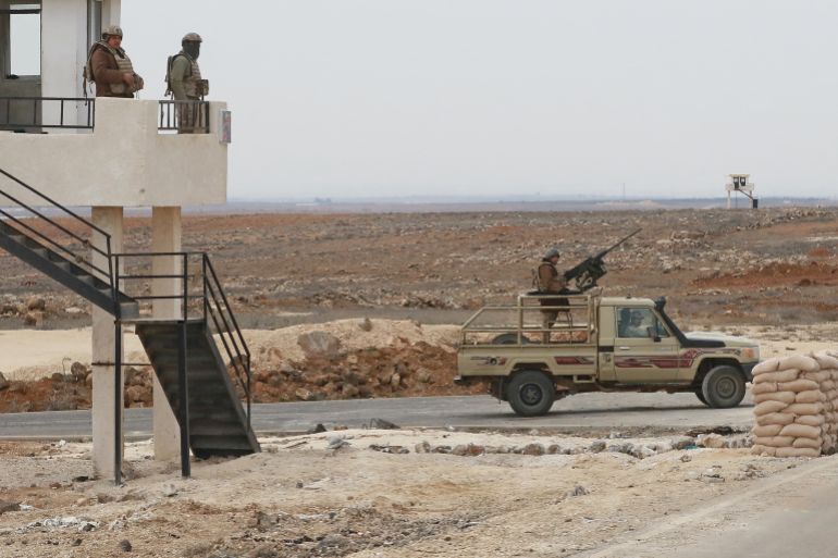A picture taken during a tour origanized by the Jordanian Army shows soldiers patrolling along the border with Syria to prevent trafficking, on February 17, 2022. Drug trafficking from Syria into Jordan is becoming "organised" with smugglers stepping up operations and using sophisticated equipment including drones, Jordan's army said, warning of a shoot-to-kill policy. Since the beginning of this year, Jordan's army has killed 30 smugglers and foiled attempts to smuggle into the kingdom from Syria 16 million Captagon pills -- more than they seized in the whole of 2021 -- the military said. (Photo by Khalil MAZRAAWI / AFP)