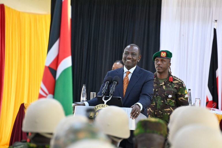 أفريكا ريبورت: صورة كينيا كوسيط محايد تتصدع وسط اتهامات بإيواء متمردين 3 Kenyan President William Ruto speaks during a pre-departure briefing for the first contingent of police officers to deploy to Haiti, at Embakasi, Nairobi, Kenya, in this handout photo released June 24, 2024 "William Samoei Ruto" via X/Handout via REUTERS THIS IMAGE HAS BEEN SUPPLIED BY A THIRD PARTY. NO RESALES. NO ARCHIVES. MANDATORY CREDIT