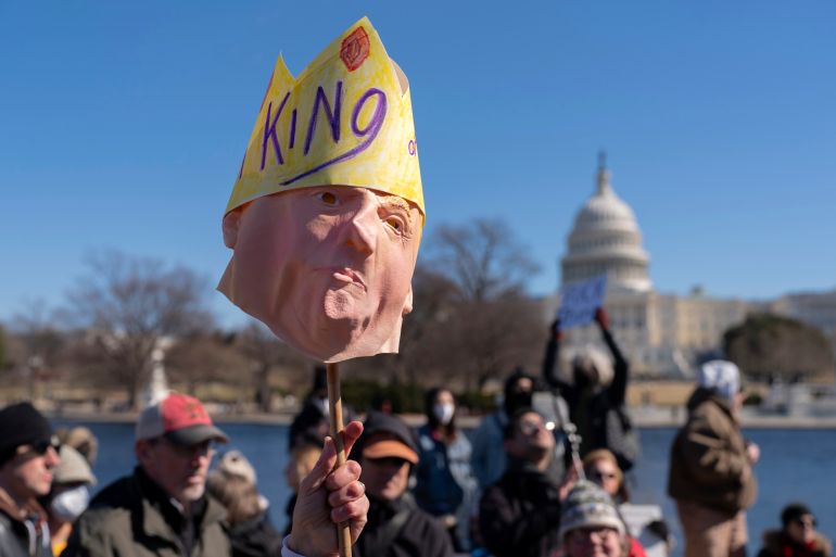 صحف أميركية: سيطرة ترامب على واشنطن توسع سيطرة الجيش وتهدد الديمقراطية 1 People take part in the "No Kings Day" protest on Presidents Day in Washington, in support of federal workers and against recent actions by President Donald Trump and Elon Musk, Monday, Feb. 17, 2025, by the Capitol in Washington. The protest was organized by the 50501 Movement, which stands for 50 Protests 50 States 1 Movement. (AP Photo/Jose Luis Magana)