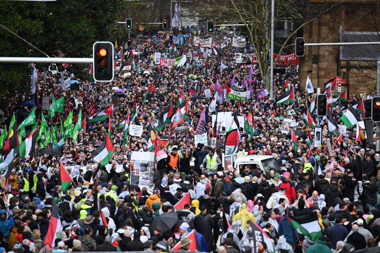 Thousands of protesters line streets ahead of a march across the Sydney Harbour Bridge during the Palestine Action Group's March for Humanity in Sydney, Sunday, August 3, 2025. (Dean Lewins/AAP Image via AP)