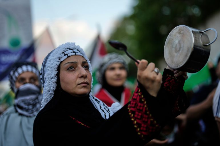 Demonstrators chant slogans during a protest outside the U.S. consulate in Istanbul, Turkey, Sunday, Aug. 3, 2025, to show solidarity with Palestinians amid the ongoing war in Gaza. (AP Photo/Khalil Hamra)