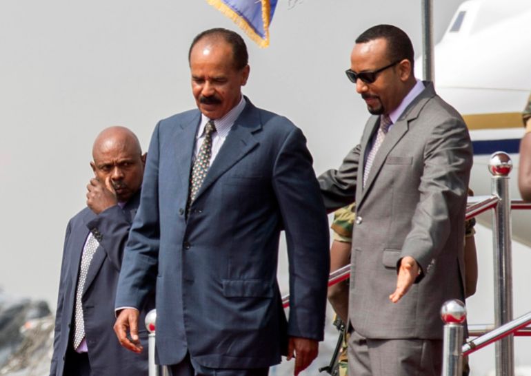 ترامب وأفورقي.. ما تخفيه الرسائل المتبادلة بين إريتريا والولايات المتحدة 5 FILE - In this Saturday, July 14, 2018 file photo, Eritrean President Isaias Afwerki, left, is welcomed by Ethiopia's Prime Minister Abiy Ahmed upon his arrival at Addis Ababa International Airport, Ethiopia. The 2019 Nobel Peace has been awarded to Ethiopian Prime Minister Abiy Ahmed. Ahmed was cited for his efforts to achieve peace and international cooperation, and in particular for his decisive initiative to resolve the border conflict with neighbouring Eritrea. (AP Photo Mulugeta Ayene, File)