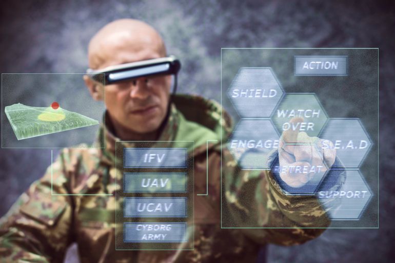 السيادة الرقمية.. عندما يرتهن مصير دول بكبسة زر 2 futuristic soldier piloting drones trough holographic console