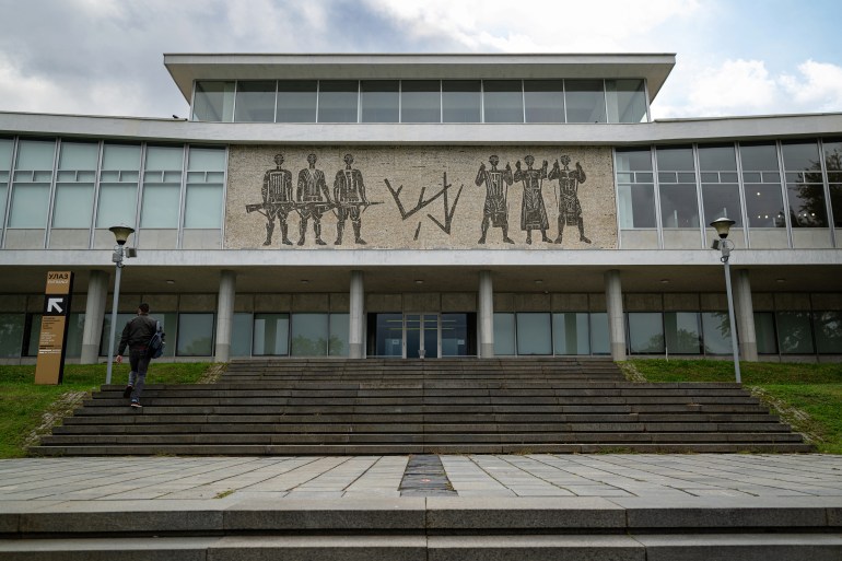 A member of the public walks man in front of the Museum of Yugoslavia in Belgrade , on October 6, 2024. - Belgrade's tourist hotspot, the Museum of Yugoslavia, is at risk of losing its most visited site  the resting place of socialist Yugoslavia's President, Josip Broz Tito, due to decades-long ideological disputes. The citys nationalist mayor, Aleksandar Sapic, publicly called for moving Tito's grave to his native Croatia, despite it attracting over 120,000 visitors annually, arguing that the Belgrade needs to "move away from communism". (Photo by Andrej ISAKOVIC / AFP)