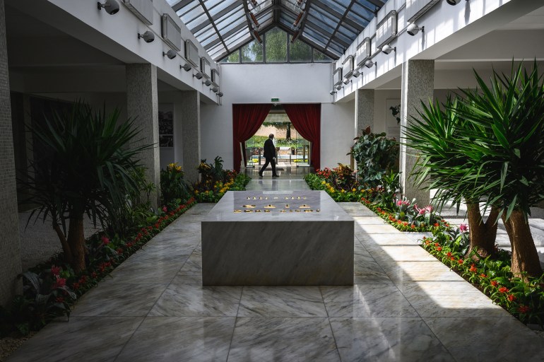 (FILES) A security staff walks past the tomb of Josip Broz Tito (1892–1980), former President of communist Yugoslavia, at his resting place inside of the "House of flowers", located in the Museum of Yugoslav History in Dedinje neighborhood, in Belgrade on April 30, 2020. - Belgrade's tourist hotspot, the Museum of Yugoslavia, is at risk of losing its most visited site – the resting place of socialist Yugoslavia's President, Josip Broz Tito, due to decades-long ideological disputes. The city’s nationalist mayor, Aleksandar Sapic, publicly called for moving Tito's grave to his native Croatia, despite it attracting over 120,000 visitors annually, arguing that the Belgrade needs to "move away from communism". (Photo by Andrej ISAKOVIC / AFP)