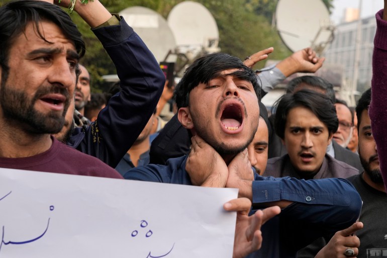 Shiite Muslims chant slogans to condemn the killing of Shiite Muslims by gunmen in an ambush in Kurram district, during a demonstration in Lahore, Pakistan, Friday, Nov. 22, 2024. (AP Photo/K.M. Chaudary)