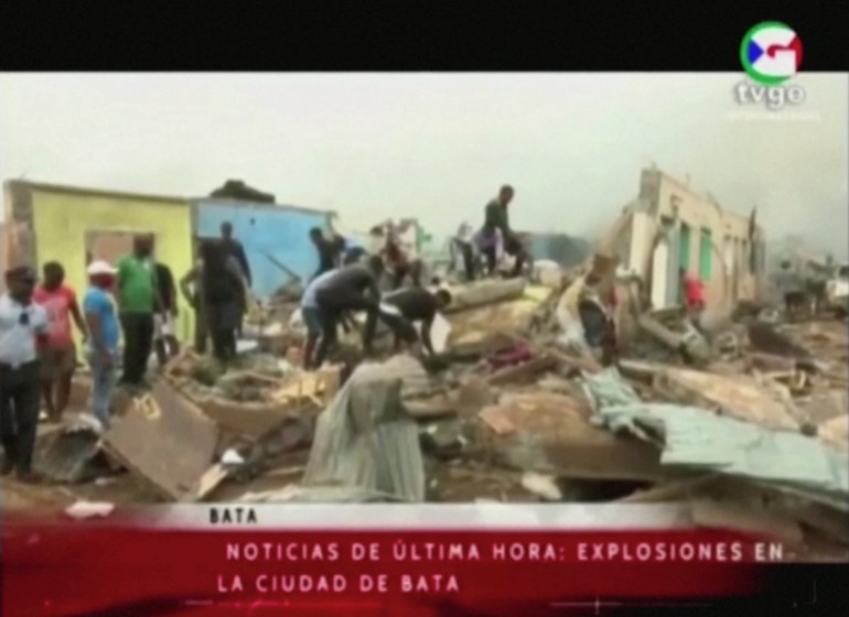 People search through rubble following explosions at a military base, according to local media, in Bata, Equatorial Guinea March 7, 2021. TVGE/REUTERS TV/via REUTERS THIS IMAGE HAS BEEN SUPPLIED BY A THIRD PARTY. MANDATORY CREDIT. NO RESALES. NO ARCHIVES. EQUATORIAL GUINEA OUT.