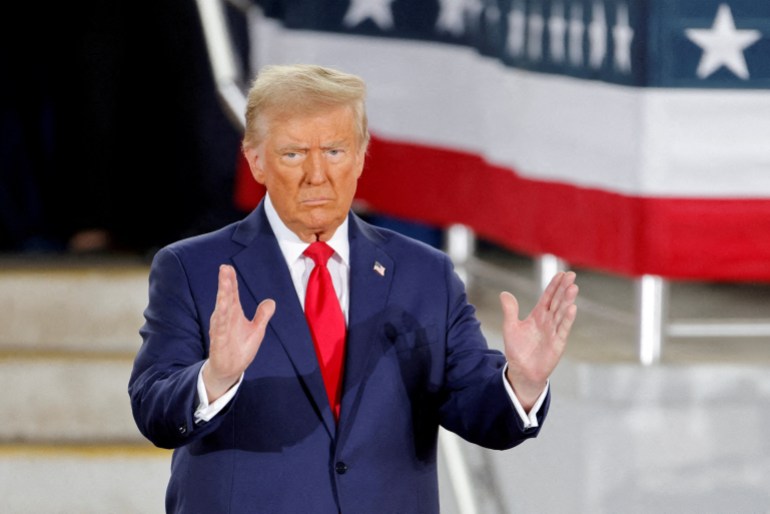 FILE PHOTO: Republican then-presidential candidate and former U.S. President Donald Trump gestures during a campaign event at Dorton Arena, in Raleigh, North Carolina, U.S. November 4, 2024. REUTERS/Jonathan Drake/File Photo