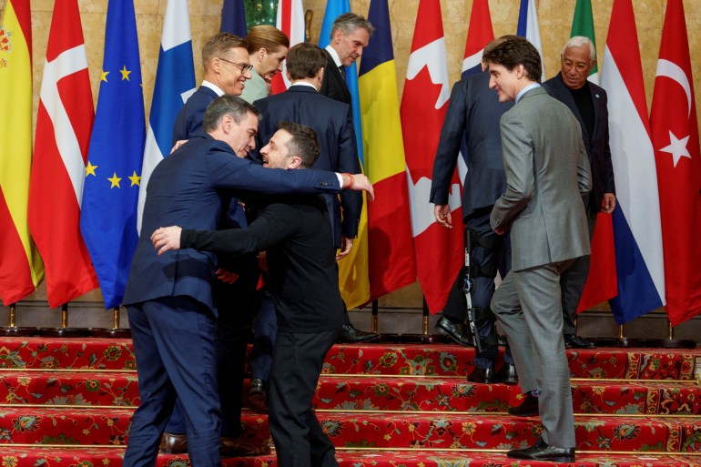 President Volodymyr Zelenskiy and Spain's Prime Minister Pedro Sanchez embrace each other as Canada's Prime Minister Justin Trudeau and Finland's President Alexander Stubb look on during the European leaders' summit to discuss European security and Ukraine, at Lancaster House in London, Britain, March 2, 2025. NTB/Javad Parsa/via REUTERS ATTENTION EDITORS - THIS IMAGE WAS PROVIDED BY A THIRD PARTY. NORWAY OUT. NO COMMERCIAL OR EDITORIAL SALES IN NORWAY.