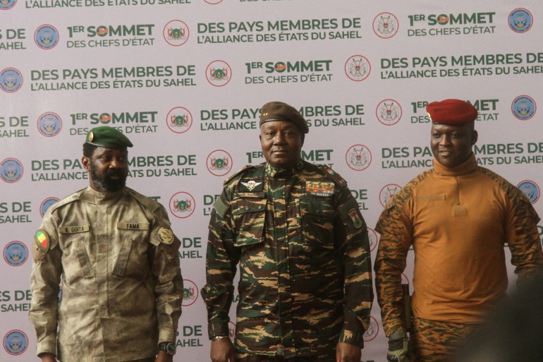 Heads of state of Mali's Assimi Goita, Niger's General Abdourahamane Tiani and Burkina Faso's Captain Ibrahim Traore pose for photographs during the first ordinary summit of heads of state and governments of the Alliance of Sahel States (AES) in Niamey, Niger July 6, 2024. REUTERS/Mahamadou Hamidou