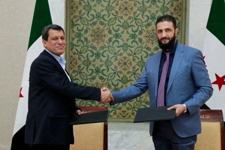 العقوبات وإسرائيل وقسد.. ماذا تريد أميركا من سوريا الجديدة؟ 20 سوريا - دمشق - وصف اتفاق دمشق و"قسد" بأنه اتفاق تاريخي ويمهد لمرحلة جديدة في سوريا (الجزيرة)
