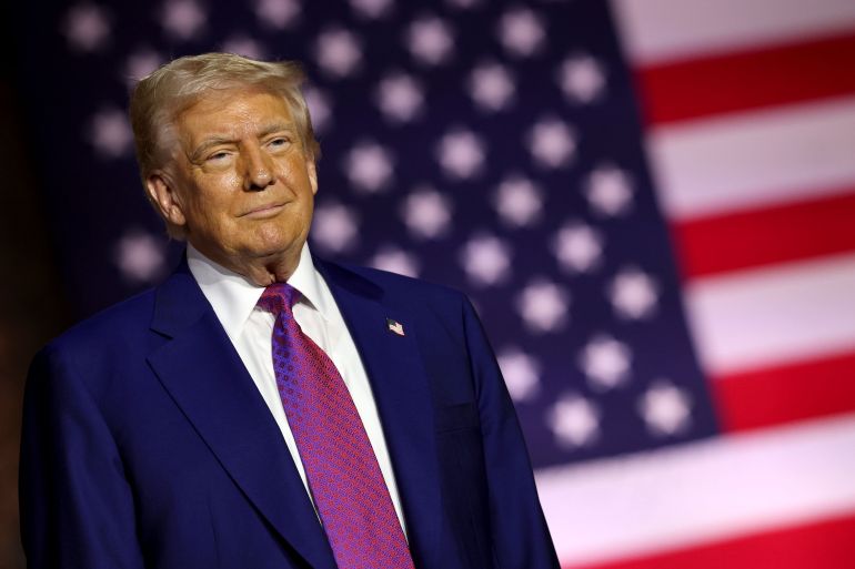 قلق إسرائيلي وتطمينات أميركية بشأن قرب الاتفاق حول نووي إيران 20 DOHA, QATAR - MAY 15: U.S. President Donald J. Trump stands on stage as he tours the Al Udeid Air Base on May 15, 2025, in Doha, Qatar. Trump is on the third day of his visit to the Gulf to underscore the strategic partnership between the United States and Qatar, focusing on regional security and economic collaboration. (Photo by Win McNamee/Getty Images)