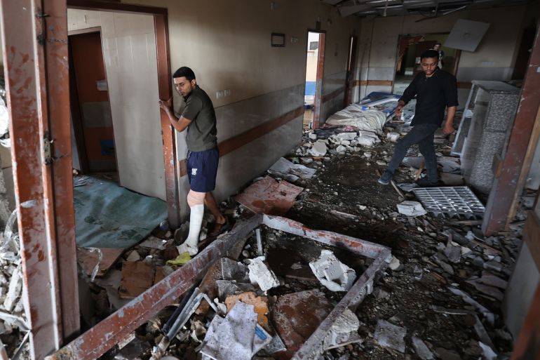 غزة تنزف بلا ضماد.. كارثة صحية في زمن التجاهل الدولي 9 Palestinians inspect the destruction inside Nasser hospital in Khan Yunis in the southern Gaza Strip following an Israeli strike early on May 13, 2025, in which Palestinian journalist Hassan Aslih was killed along with several others.