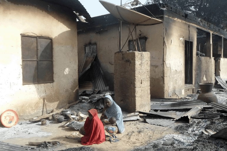6 دول أفريقية على قائمة مؤشر الإرهاب العالمي.. ما دلالات ذلك؟ 19 TOPSHOT-NIGERIA-UNREST-ISLAMISTS TOPSHOT - A mother sits mourning the death of her husband after Boko Haram attacks at Dalori village on the outskirts of Maiduguri in northeastern Nigeria on January 31, 2016. Around 50 people were killed when Boko Haram fighters armed with guns and explosives attacked a village in northeastern Nigeria, medics and local residents said on on January 31. Nigeria's army said the gunmen attacked Dalori just outside the northern city of Maiduguri late on January 30, burning down the village and sending residents fleeing into the bush. (Photo by STRINGER / AFP) (Photo by STRINGER/AFP via Getty Images)