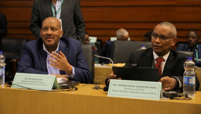 ماذا يعني نزع القانونية عن جبهة تحرير تيغراي؟ 21 Getachew Reda, President of the Interim Regional Administration of Tigray and Debretsion Gebremichael, Chairman of Tigray People's Liberation Front (TPLF) attend the launch of the report on the Pretoria peace agreement during the 38th Ordinary Session of the Assembly of the Heads of State and Government of the African Union (AU) at the headquarters in Addis Ababa, Ethiopia, February 16, 2025. REUTERS/Tiksa Negeri