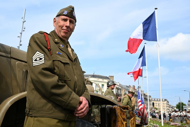 بالصور.. روسيا وأوروبا تحييان ذكرى الانتصار على النازية 34 A reenactor dressed in a US paratrooper WWII uniform takes part in the Commemoration of the 80th anniversary of the end of World War II in Europe, in Reims, north eastern France, where Nazi Germany signed its initial 1945 surrender, on May 7, 2025.