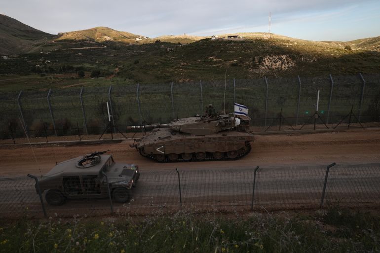 التفكيك ونشر الفوضى خيار إسرائيل بسوريا بدل التطبيع معها 21 epa12084273 Israeli Merkava tanks roll past the ceasefire line, on their way to the buffer zone between Israel and Syria near the village of Majdal Shams in the Israeli-annexed Golan Heights, 08 May 2025. The Israeli army reported that it has begun operating a mobile forward facility for triaging the wounded in southern Syria, in the area of the village of Hadar. EPA-EFE/ATEF SAFADI