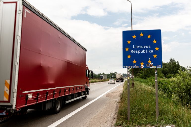 شبح "الرجال الخضر الصغار" يخيم على دول البلطيق 20 A lorry with goods passes the Lithuanian border sign to enter Lithuania on June 29, 2022 at Polish-Lituanian border on the busy E67 road. The Polish border with Lithuania is situated between Kaliningrad oblast (part of Russia) and Belarus and stretches 100 kilometers. The Area is called Suwalki Gap and is the only connection between Baltic States and the rest of the NATO and European Union. After Lithuania refused to transport sanctioned goods via rail from Russia's mainland to Kaliningrad, Vladimir Putin, Russian president, threatened Lithuania with serious consequences. Both NATO and European Union worry that Suwalki Gap, a relatively narrow corridor with Baltic States can be attacked by Russia