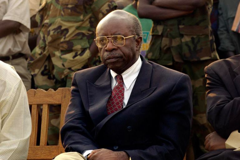 Former Rwandan Prime Minister Faustine Twagiramungu waits to address a rally in Cyangugu, Rwanda, 13 August 2003. Twagiramungu is the main opposition candidate in the presidential elections set 25 August. (Photo by GIANLUIGI GUERCIA / AFP)