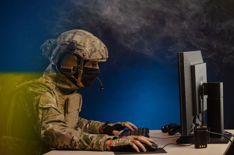 دروس سوريا الجديدة من حرب إيران وإسرائيل 2 military in uniform sitting at a computer conducts cyber warfare