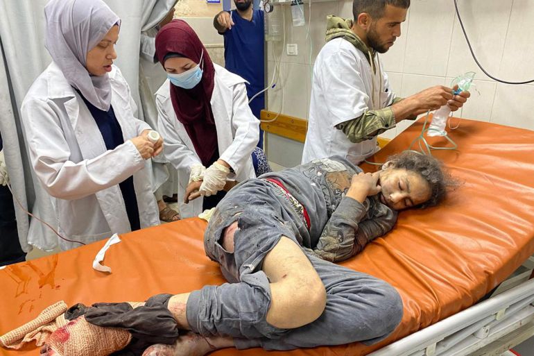 بالصور.. مساعدات غزة طرود مخضبة بالدماء 12 Palestinian doctors caring for a girl who was injured in Israeli air strikes, at the Nasser hospital in Khan Yunis in the southern Gaza Strip, on May 15, 2025. Gaza rescuers said Israeli strikes and shelling on May 15 killed 82 people in the war-battered Palestinian territory, updating a previous toll.PHOTO: AFP