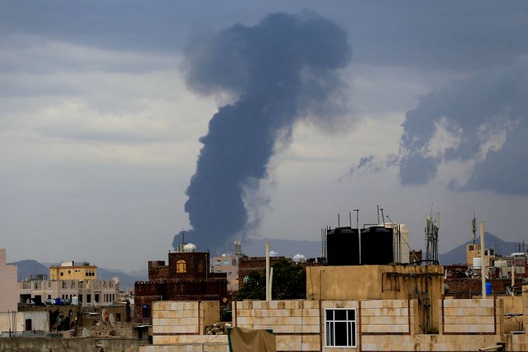 Smoke billows on the horizon following an Israeli air strike on Yemen's Huthi-held capital Sanaa on May 6, 2025. Israeli air raids struck Yemen's main airport and power stations in the Sanaa area on May 6, Huthi media and Israel's military said, the latest retaliation for a missile attack by the Iran-backed rebels. (Photo by Mohammed HUWAIS / AFP)