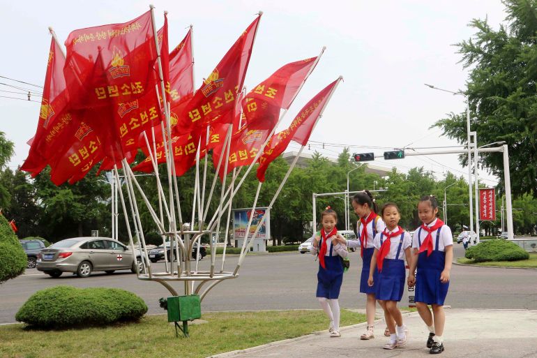 أغرب شروط للتأشيرة تفرضها بعض دول العالم 3 Children walk past the flags, in the street of Pothonggang District, Pyongyang, North Korea Friday, June 6, 2025, the 79th anniversary day of the founding of the Korean Children's Union. (AP Photo/Jon Chol Jin)