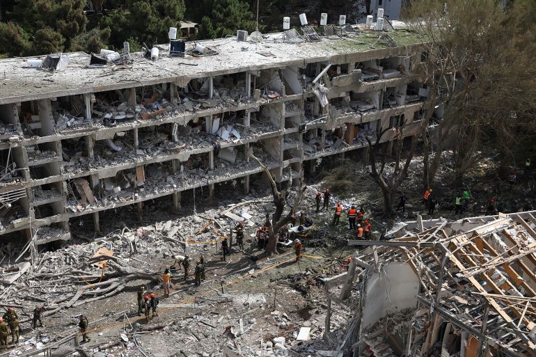 صحف إسرائيلية: هدنة ترامب تريح طهران وتنعش مفاوضات غزة 1 Emergency personnel work at an impact site following a missile attack from Iran on Israel, amid the Iran-Israel conflict, in Tel Aviv, Israel, June 22, 2025. REUTERS/Violeta Santos Moura