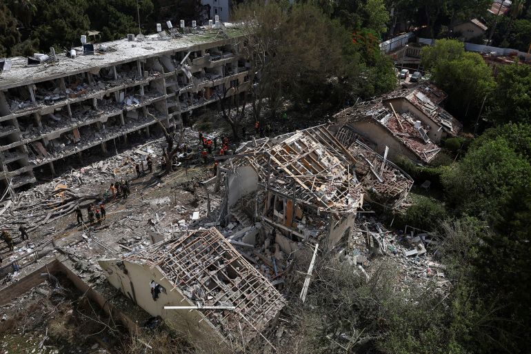 Emergency personnel work at an impact site following a missile attack from Iran on Israel, amid the Iran-Israel conflict, in Tel Aviv, Israel, June 22, 2025. REUTERS/Violeta Santos Moura TPX IMAGES OF THE DAY