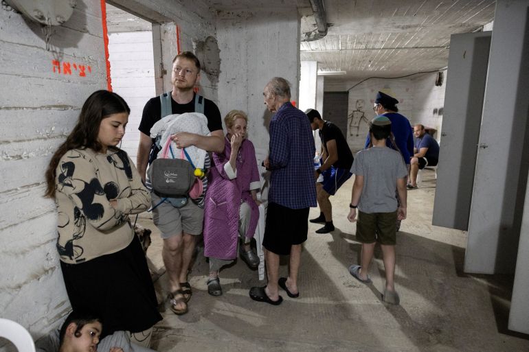 بالصور.. دمار "غير مسبوق" في إسرائيل بعد ضربات إيران 5 Israelis gather in a shelter following sirens in Tel Aviv, Israel June 13, 2025 REUTERS/Itay Cohen TPX IMAGES OF THE DAY
