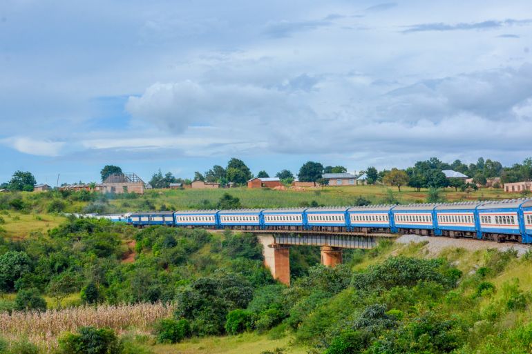 5 أسئلة لفهم الممرات الاقتصادية في شرق أفريقيا 2 Tanzania Zambia Railways(TAZARA) Train going through tunnels and hills of Tanzania Mbeya Region. A high capacity train used by tourists and local commuters to travel in between Kapiri Mposhi and Dar.