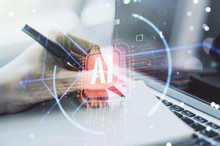 “الدين المعرفي”.. هل تقودنا سهولة الذكاء الاصطناعي لفقدان قدراتنا الإبداعية؟ 1 Double exposure of creative artificial Intelligence abbreviation with hand writing in notepad on background with laptop. Future technology and AI concept