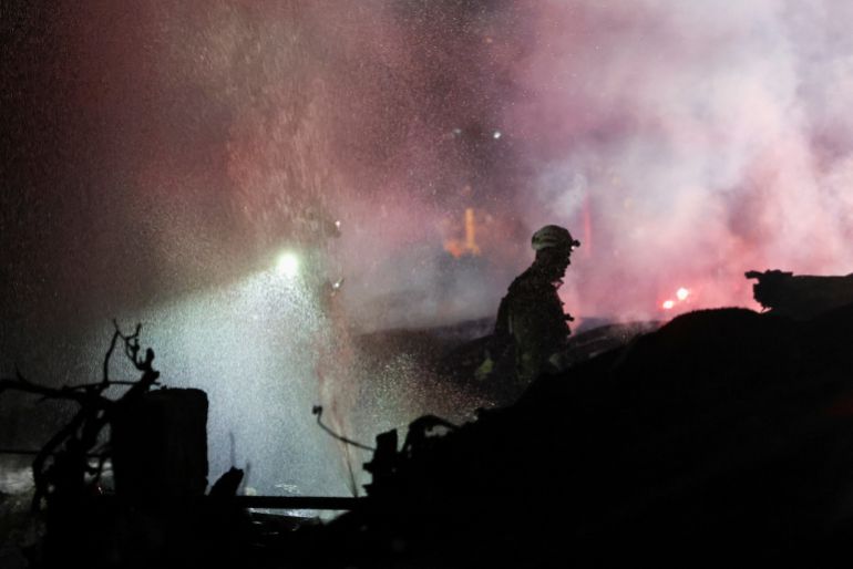 إسرائيل وإيران.. قواعد الاشتباك من حروب الوكالة للمواجهة المباشرة 1 Emergency personnel operate after missiles were launched from Iran to Israel, in Haifa, Israel, June 15, 2025. REUTERS/Shir Torem