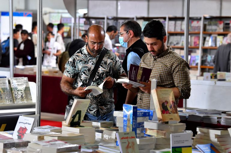 هل يمكن للترجمة تسويق الأدب الجزائري دوليا رغم تحديات الاقتصاد والثقافة؟ 3 People visit the 37th Tunis International Book Fair in the Tunisian capital on April 29, 2023. The Tunisian president preached freedom of thought at the fair on April 28, shortly before authorities confiscated a book comparing him to Frankenstein, the publisher said. (Photo by FETHI BELAID / AFP)