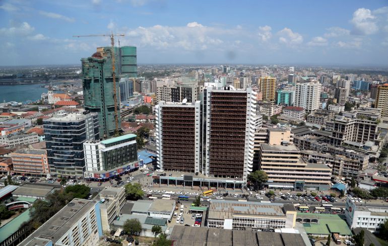 مصريون يجدون "وطنا ثانيا" في تنزانيا بعد الهجرة جنوبا 2 A general picture shows the skyline of Tanzania's port city of Dar es Salaam, July 12, 2013. Tanzania's commercial capital looks like a boom town even before cash rolls in from gas discoveries that in the next few years could make the east African nation a major energy exporter. Glass-clad tower blocks pierce Dar es Salaam's sky-line and more are emerging from noisy building sites. Billboards advertise high-definition televisions and other electronics to a new middle class, who crowd brand new shopping malls. REUTERS/Andrew Emmanuel (TANZANIA - Tags: SOCIETY BUSINESS ENERGY)