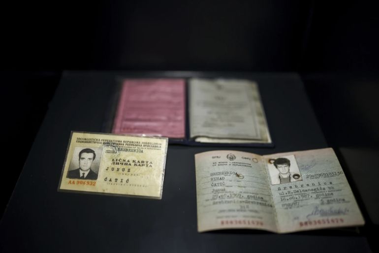 Personal documents found in a mass grave are shown as a part of the exhibition “Lives Beyond the Fields of Death” opened at the Srebrenica Memorial Center in Potocari, Bosnia, Thursday, July 10, 2025. (AP Photo/Armin Durgut)