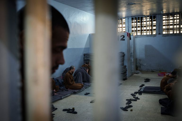 نيويورك تايمز: ما الذي تتوقعه واشنطن من حكومة الشرع في سوريا؟ 1 Inmates accused of being an Islamic State (ISIS) fighters sit inside a cell at the Syrian Democratic Forces-run Gweiran Prison, now called Panorama, in Hassakeh, northeastern Syria, Friday, Jan. 31, 2025. (AP Photo/Bernat Armangue)