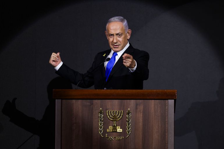 TOPSHOT - Israeli Prime Minister Benjamin Netanyahu delivers a statement during the US Independence Day reception, known as the annual "Fourth of July" celebration, hosted by Newsmax in Jerusalem on August 13, 2025. (Photo by Ronen Zvulun / POOL / AFP)