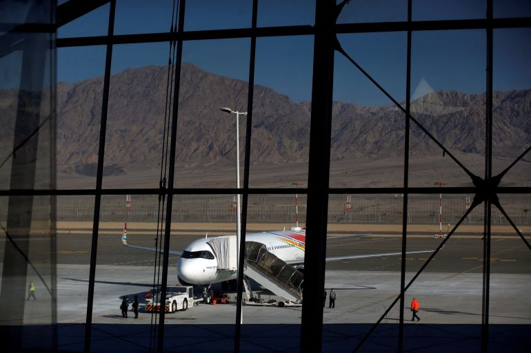 FILE PHOTO: A plane is reflected in the facade of the Ramon International Airport after an inauguration ceremony for the new airport, just outside the southern Red Sea resort city of Eilat, Israel January 21, 2019. REUTERS/Ronen Zvulun/File Photo