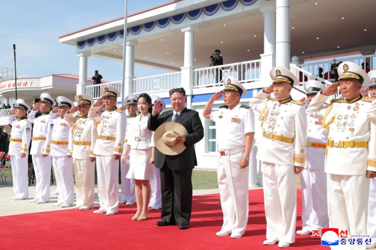 North Korean leader Kim Jong Un and his daughter Kim Ju Ae attend the launching ceremony of a warship that had been damaged upon its first attempt to launch, in Rajin, North Korea, June 12, 2025 in this photo released by North Korea's official Korean Central News Agency. KCNA via REUTERS ATTENTION EDITORS - THIS IMAGE WAS PROVIDED BY A THIRD PARTY. REUTERS IS UNABLE TO INDEPENDENTLY VERIFY THIS IMAGE. NO THIRD PARTY SALES. SOUTH KOREA OUT. NO COMMERCIAL OR EDITORIAL SALES IN SOUTH KOREA.