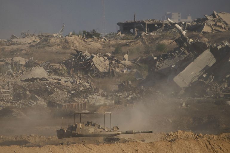 الصور تكشف تدمير إسرائيل أحياء مدينة غزة قبل احتلالها 1 Israeli soldiers drive a tank inside the Gaza Strip as seen from southern Israel, Wednesday, Sept. 3, 2025. (AP Photo/Ariel Schalit)