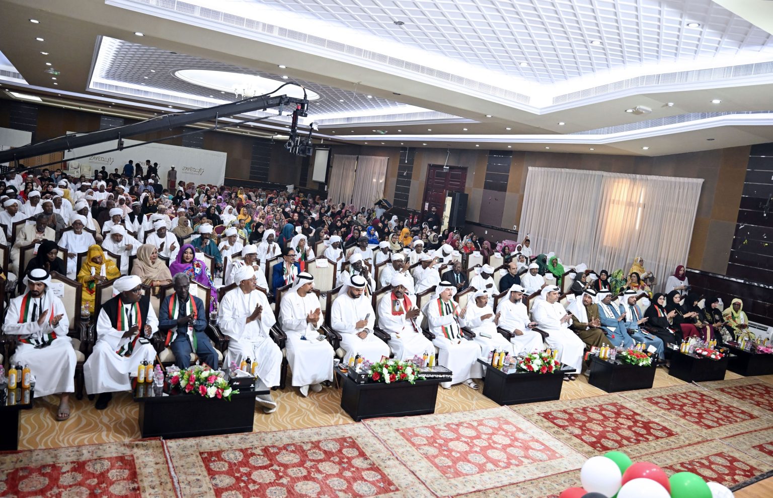 الجالية السودانية في الإمارات تحتفي بعيد الاتحاد الـ 54 1765120901 image